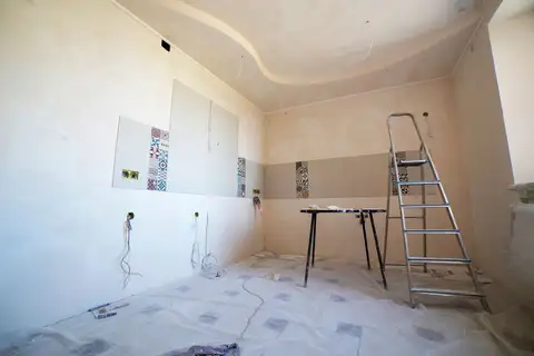 Interior room mid-renovation with tools and materials